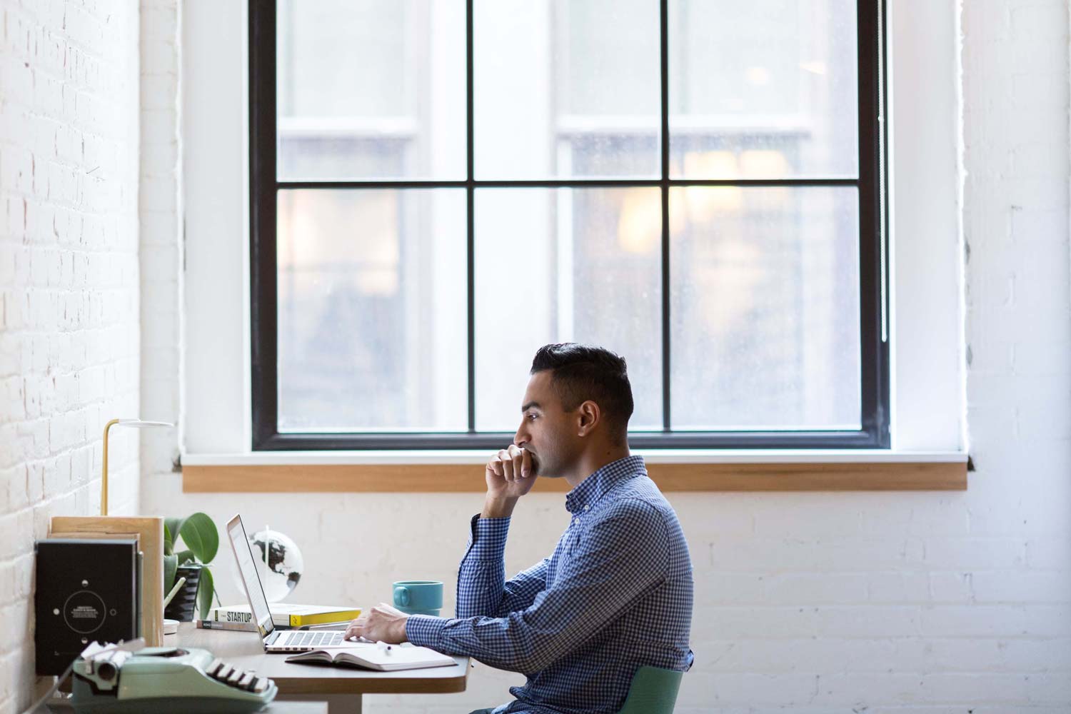 A man solving problems on a laptop