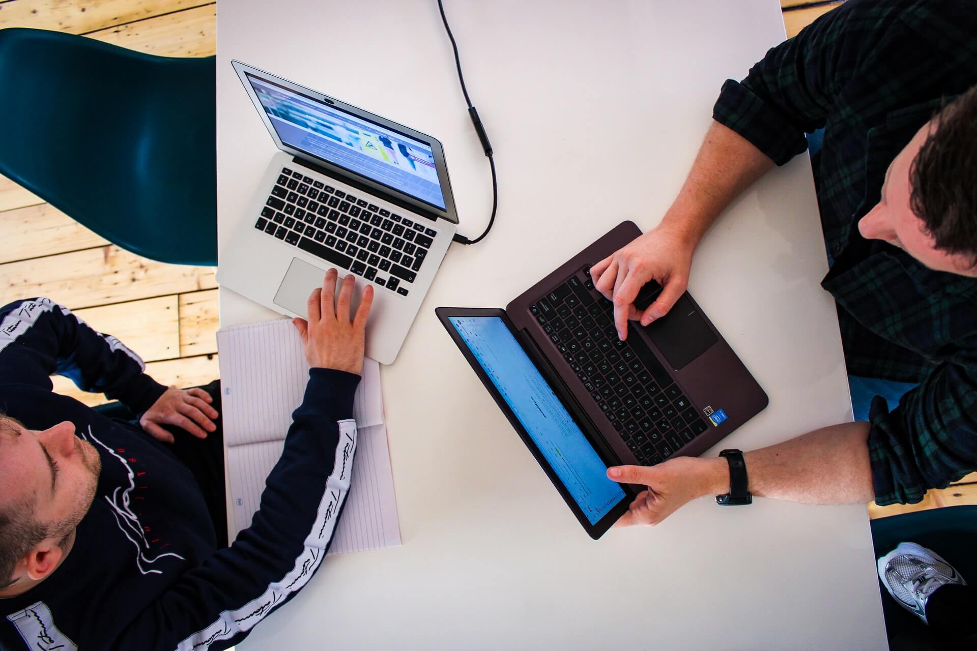 two no code developers discussing a project